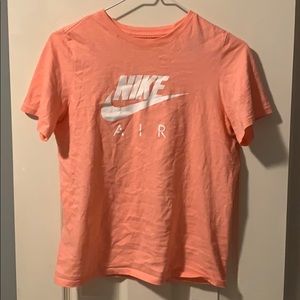Peach Nike shirt